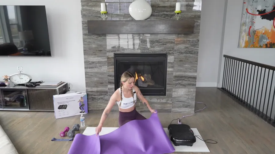 Instructor demonstrating a guided plate exercise at home