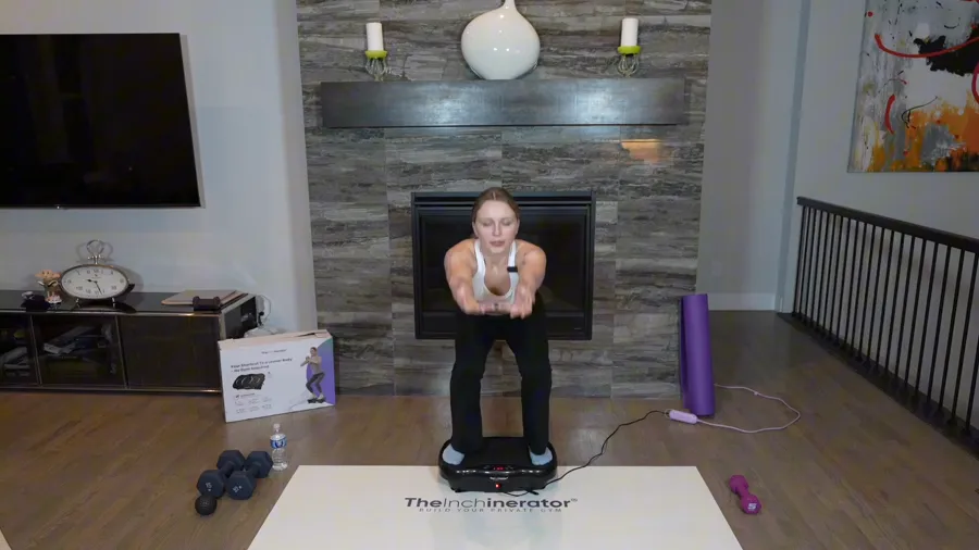 Instructor demonstrating a supported squat on the plate